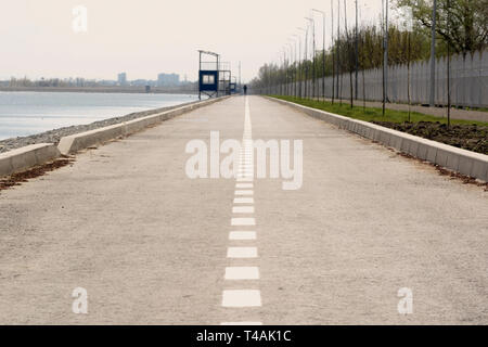 highway with a dividing strip goes into the distance Stock Photo