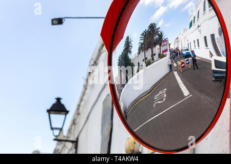 Roadblock by police because of the market in Teguise in Spain seen in a traffic security mirror Stock Photo