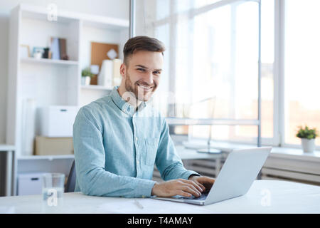 Handsome Man Using Laptop Stock Photo