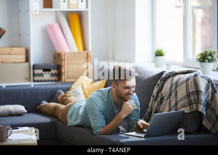 Young Man Relaxing at Home Stock Photo