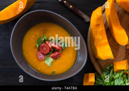 Pumpkin soup in a ceramic bowl - top view Stock Photo