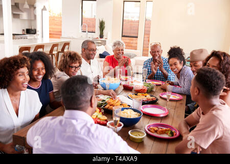 Three generation black family celebrating grandmother's birthday together,close up Stock Photo