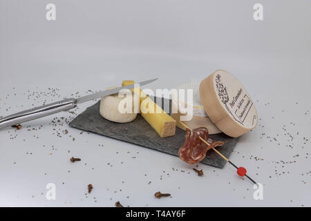 Cheese tasting tray with a slice of sausage Stock Photo