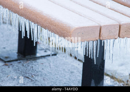 bench in freezing rain Stock Photo