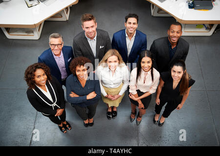 Overhead Portrait Of Business Team Standing In Modern Office Stock Photo
