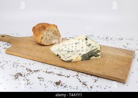 Roquefort and baguette on a wooden cutting board Stock Photo