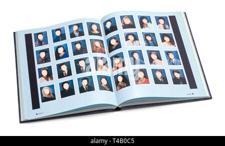 Open High School Year Book with Blank Faces Isolated on White Background. Stock Photo