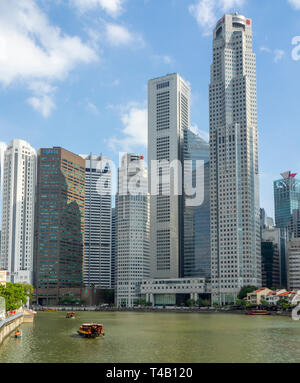 Singapore River in downtown Singapore with Boat Quay and Towers and Skyscrapers of downtown CBD. Stock Photo