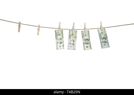 Rope with wooden clothespins and dollars isolated on white background Stock Photo