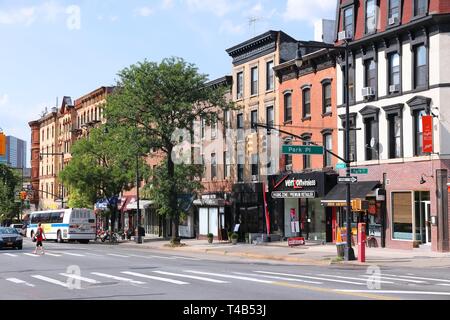 NEW YORK, USA - JULY 6, 2013: People walk in Prospect Heights, Brooklyn. New York City is visited by 56 million annual visitors (2014). 20 million peo Stock Photo