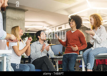 Creative team enjoying communication in modern office Stock Photo