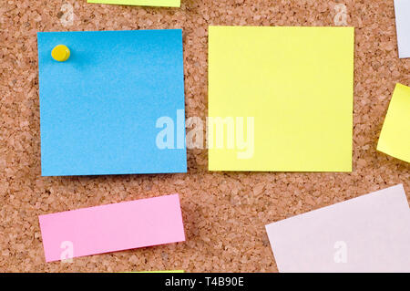 colorful note papers on cork board Stock Photo