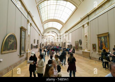 Paris, France - March 31, 2019: Visitors Walking the Louvre museum Stock Photo