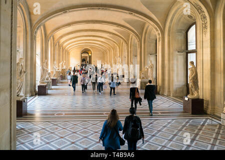 Paris, France - March 31, 2019: Visitors Walking the Louvre museum Stock Photo