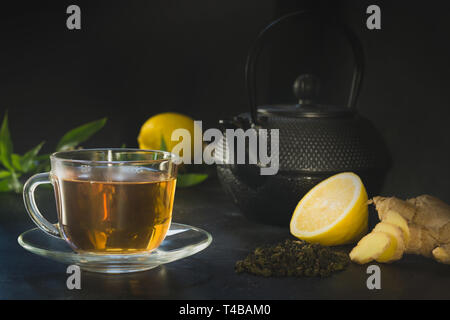 Cup of tea, ginger on dark. Chinese tea concept. Stock Photo