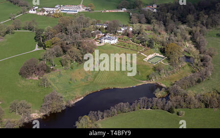 aerial view of a large private house with tennis courts fish pond lake near Congleton, Cheshire Stock Photo