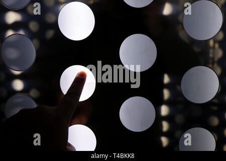 finger tapping on abstract interface digital wall - virtual room experience Stock Photo