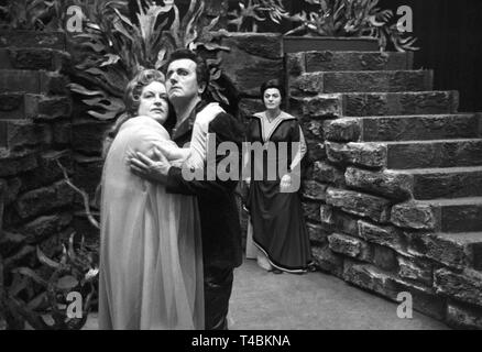On 22 May 1963, the new production of the opera 'Tristan and Iseult' is performed by the German opera on the Rhine, the theatre association of Düsseldorf and Duisburg, on the occasion of the 150th birthday of its composer Richard Wagner. The picture shows Set Svanholm (right) as Tristan and Astrid Varnay (left) as Isolde, in the background there is Fabio Giongo as Melot during the final rehearsal on 21 May 1963. | usage worldwide Stock Photo
