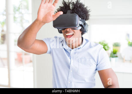 African amaerican man having fun playing with virtual reality glasses Stock Photo