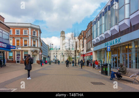 A view down George Street, a pedestrianised shopping street in Luton, Bedfordshire, UK. At the far end is the town hall. Stock Photo