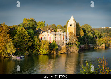 Autumn in the 9th arrondissement of Lyon: the green island Ile Barbe in the Saone Stock Photo