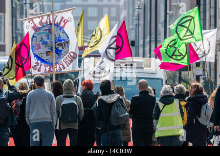 London, UK. 15th April, 2019. Blocking Oxford Street and side streets - Protestors from Extinction Rebellion block several (Hyde Park, Oxford Circus, Piccadilly Circus, Warterloo Bridge and Parliament Square) junctions in London as part of their ongoing protest to demand action by the UK Government on the 'climate chrisis'. The action is part of an international co-ordinated protest. Credit: Guy Bell/Alamy Live News Stock Photo