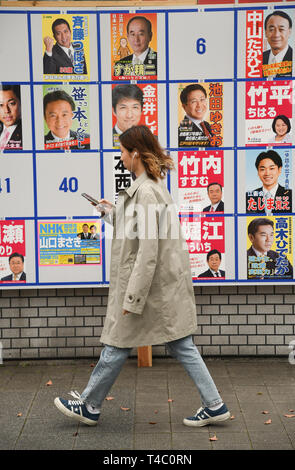 Tokyo, Japan. 14th Apr, 2019. People passes by an Edogawa ward congressional member election advertising board near Kasai Station in Tokyo Japan, voting will take place on April 22, 2019. Photo taken on Sunday, April 15, 2019. Photo: Ramiro Agustin Vargas Tabares Credit: Ramiro Agustin Vargas Tabares/ZUMA Wire/Alamy Live News Stock Photo