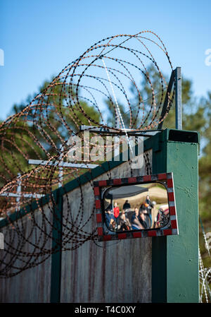 Gorleben, Germany. 15th Apr, 2019. A wall with so-called NATO wire surrounds the former exploratory mine. After decades of dispute over a repository for highly radioactive nuclear waste in Gorleben, the exploration area of the mine has been almost completely dismantled. During a symbolic final inspection of the salt dome it was now shown what the so-called open-keeping operation looks like. Credit: Philipp Schulze/dpa/Alamy Live News Stock Photo