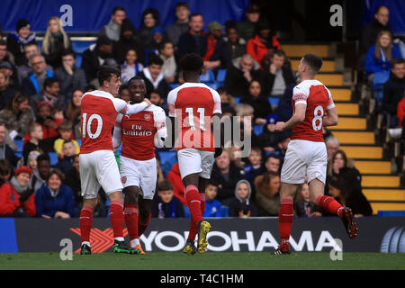 London, UK. 15th April, 2019. Eddie Nketiah  of Arsenal U23  (2L) celebrates with his teammates after scoring his team's first goal. PL2 match, Chelsea u23's v Arsenal u23's at Stamford Bridge in London on Monday 15th April 2019.  this image may only be used for Editorial purposes. Editorial use only, license required for commercial use. No use in betting, games or a single club/league/player publications. pic by Steffan Bowen/ Andrew Orchard sports photography/Alamy Live news Stock Photo