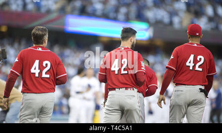 The St. Louis Cardinals line up during the national anthem wearing Jackie  Robinson's No. 42 jersey before action against the Milwaukee Brewers on  Wednesday, April 15, 2015, at Busch Stadium in St. Louis. All players and  coaches from both teams wore