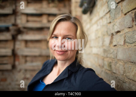 Dresden, Germany. 20th Mar, 2019. Britta Steffen, former swimmer, double Olympic champion and world champion, taken in the courtyard of the restaurant 'Elbsalon'. Credit: Robert Michael/dpa-Zentralbild/ZB/dpa/Alamy Live News Stock Photo