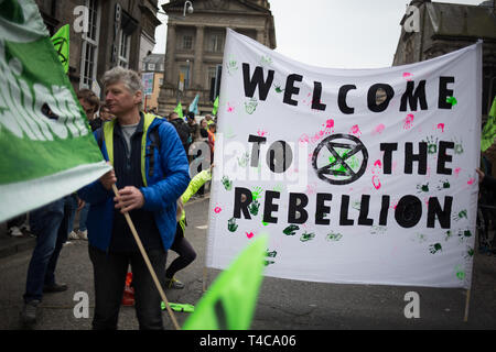 Edinburgh, Scotland, 16th April 2019. Extinction Rebellion (Scotland) climate protestors shut North Bridge to traffic during an 'International Day of Rebellion', asking for the government to declare a climate emergency, in Edinburgh, Scotland, on 16 April 2019. Credit: Jeremy Sutton-Hibbert/Alamy Live News Stock Photo