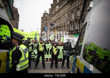 Edinburgh, Scotland, 16th April 2019. Extinction Rebellion (Scotland) climate protestors shut North Bridge to traffic during an 'International Day of Rebellion', asking for the government to declare a climate emergency, in Edinburgh, Scotland, on 16 April 2019. Credit: Jeremy Sutton-Hibbert/Alamy Live News Stock Photo