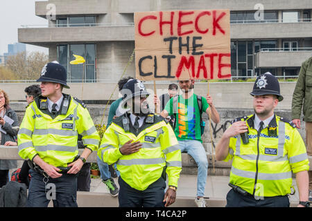 London, UK. 16th Apr, 2019. Police warn people blocking Waterloo Bridge under the public order act and then arrest them if they refuse to move to Marble Arch. It is mostly good humoured but some are dragged away to cheers from the remainder -  Day 2 - Protestors from Extinction Rebellion block several (Hyde Park, Oxford Cuircus, Warterloo Bridge and Parliament Square) junctions in London as part of their ongoing protest to demand action by the UK Government on the 'climate chrisis'. The action is part of an international co-ordinated protest. Credit: Guy Bell/Alamy Live News Stock Photo