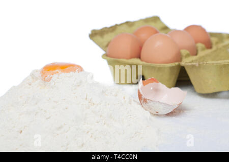 Egg yolk on sifted flour Stock Photo
