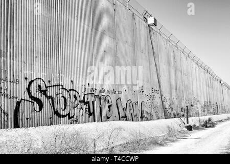 Israeli separation wall. The barrier laid the groundwork for the de-facto annexation of most settlements and much land for their future expansion. Stock Photo