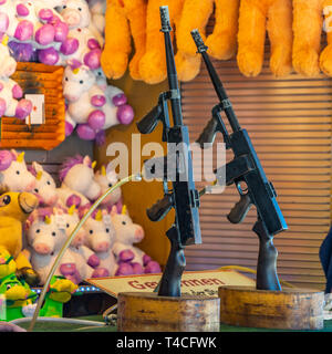 gun air rifle Shooting range gallery at funfair fair fairground with bb ...