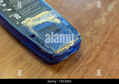 The battery compartment of an electronic device with extreme case of alkaline battery corrosion (LR6/AA/15A). Stock Photo