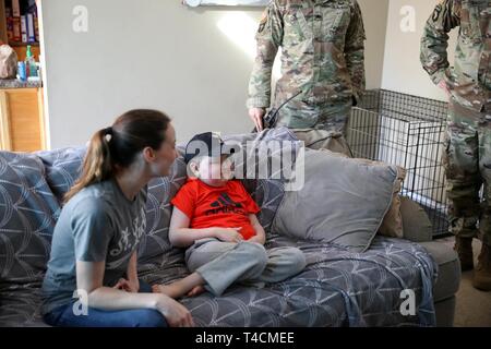 Braxton Fuqua, a participant with the Mid-Tennessee Make-A-Wish Foundation, reacts to seeing storm troopers walk in his house March 19, 2019. Staff Sgt. Justin Caton and Staff Sgt. Joseph Rodrigez, instructors at The Sabalauski Air Assault School, dressed up as storm troopers from the Star Wars series as part of the day’s events. Stock Photo