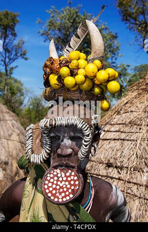 Woman with large lip plate and headdress, tribe of the Mursi, Mago National Park, Southern Nations Nationalities and Peoples' Region, Ethiopia Stock Photo