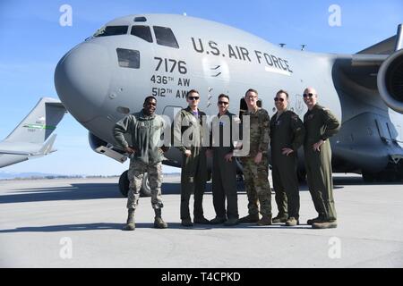 (From left) Senior Airman Sydney Edwards, Staff Sgt. Micah Ericson, Capt. Chris Rogoski, Staff Sgt. Joshua Shannon, Maj. James Johnson, and Lt. Col. Ed Szczpanik, an aircrew assigned to the 3rd Airlift Squadron, Dover Air Force Base, Del., conducts air refueling training with a Boeing KC-46A Pegasus on March 22, 2019 near Fairchild Air Force Base, Wash. The training marks the first time a Dover AFB aircraft and 3rd Airlift Squadron C-17 has refueled with the new KC-46 tanker Stock Photo