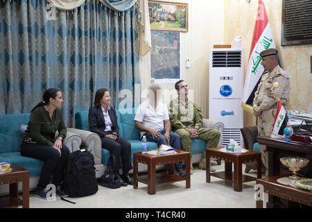 Australian ambassador to Iraq, Dr. Joanne Loundes, and New Zealand ambassador to Iraq, Ms. Tredene, speak with Col. Shehab, Commander of the Iraqi 2nd Non-Commission Officer School of Infantry (SINCO2) at Taji Military Complex, Iraq, March 18, 2019. Training delivered at SINCO2 is overseen by Task Group Taji -8 (TGT-8) instructors. This training involves lessons on how to plan, organize, deliver, and assess a wide range of training packages. The primary focus of these packages is on core infantry skills such as shooting, field craft, and maneuver at squad, platoon, and company levels. TGT-8 is Stock Photo