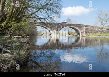 Ouse Bridge over the River Derwent at the outlet of Bassenthwaite Lake, Dubwath, Cumbria, England, UK Stock Photo