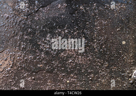 Close up image of the surface of a piece of painted metal. Stock Photo
