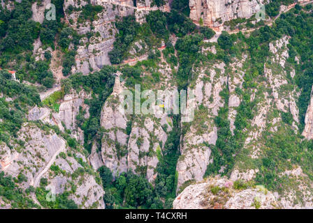 Yellow cable car in the Aeri de Montserrat rise to de Montserrat Abbey near Barcelona, Spain, Catalonia Stock Photo