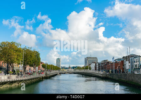 Dublin, OCT 28: Morning view of the famous Ha'penny Bridge with The Custom House behind on OCT 28, 2018 at Dublin, Ireland Stock Photo