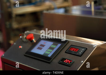 Touch screen control panel of modern industrial equipment. Selective focus. Stock Photo