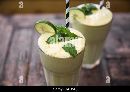 Morning breakfast smoothie drink made of super foods, fruits, mint. Healthy food concept. Stock Photo