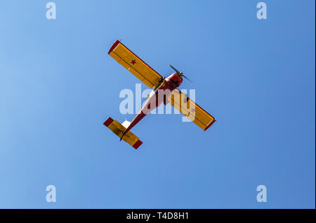 Samara region, Russia - April 13, 2019: Simple Polish plane Wilga 35 flying in the blue sky Stock Photo