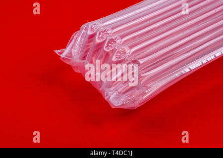 Plastic packaging with air cushion on red background Stock Photo